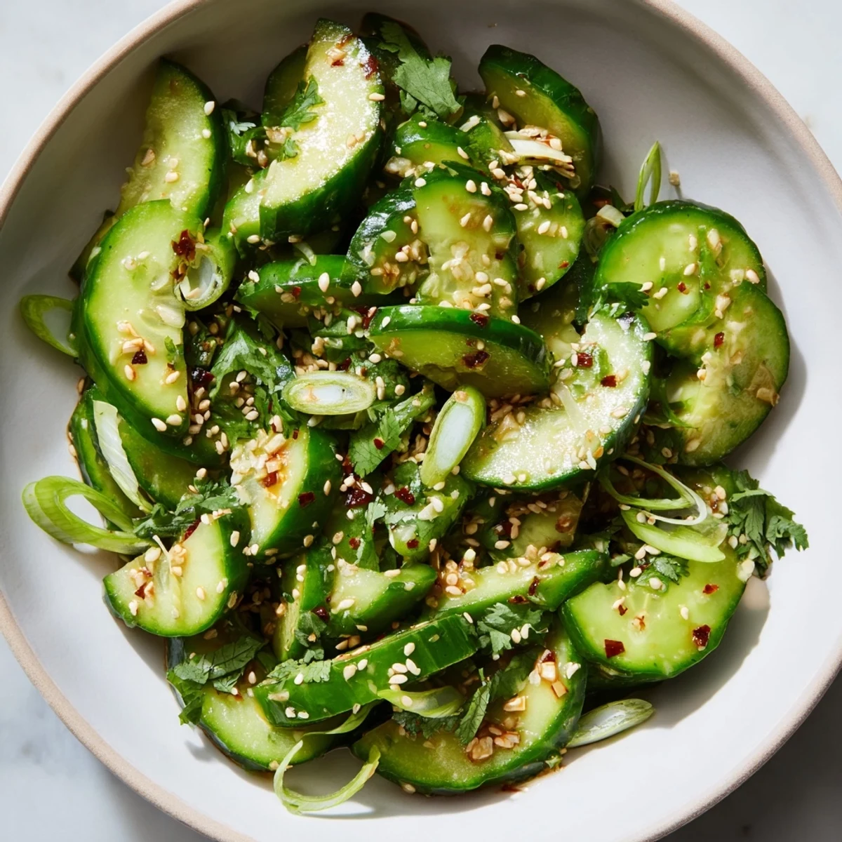 A close-up shot of the fresh Zesty Shake Cucumber Salad, showcasing its vibrant, colorful presentation and textures.