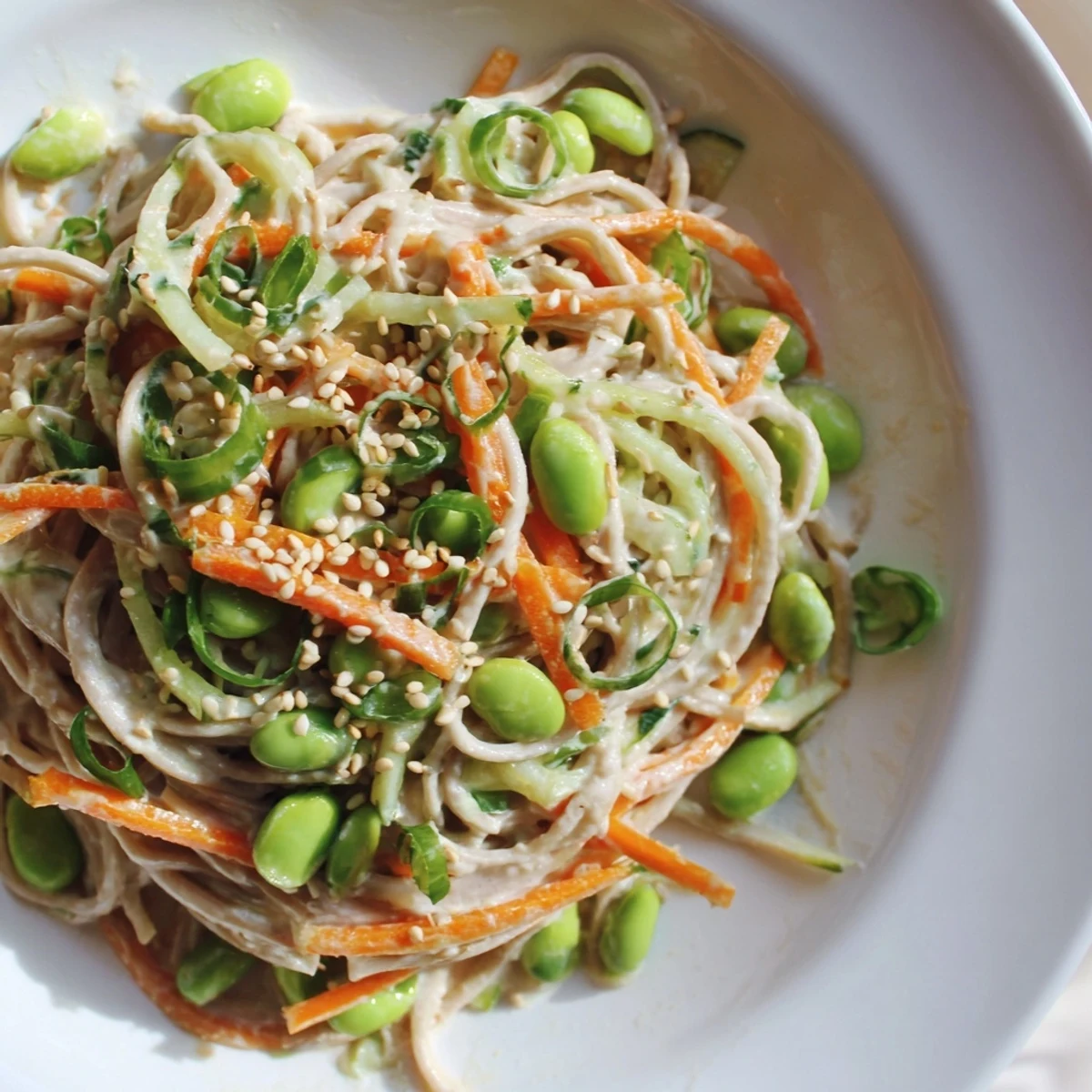 Cool, refreshing Asian Sesame Noodle Salad with visible sesame seeds sprinkled on top and ready to serve.