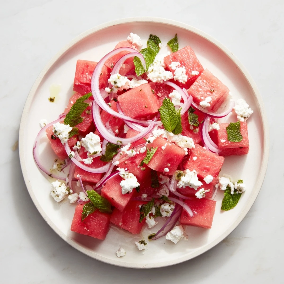 Vibrant Watermelon Feta Salad shows juicy watermelon cubes with crumbled feta and fresh mint.