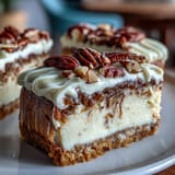 Creamy cheesecake swirled with spiced carrot cake, topped with smooth cream cheese frosting. Perfect for spring dessert gatherings.
