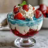 Red, white, and blue layered Jello cups with vibrant stripes, perfect for patriotic parties and summer celebrations.