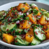 Sweet mango, crunchy cucumber, and zesty Tajín salad, perfectly chilled.