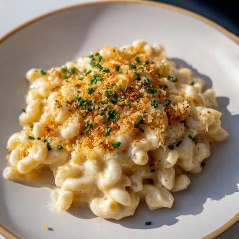 A hot, creamy bowl of Golden Comfort Food: Creamy Stove-Top Mac and Cheese, perfect for a cozy supper.