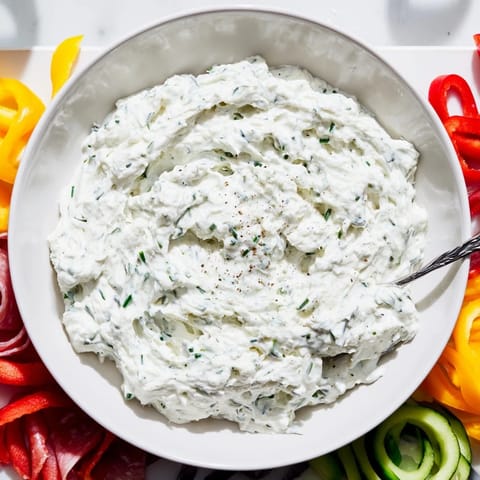 Imagine the artistry of The Medusa Curls with swirling salami, prosciutto, and veggies; a stunning appetizer.