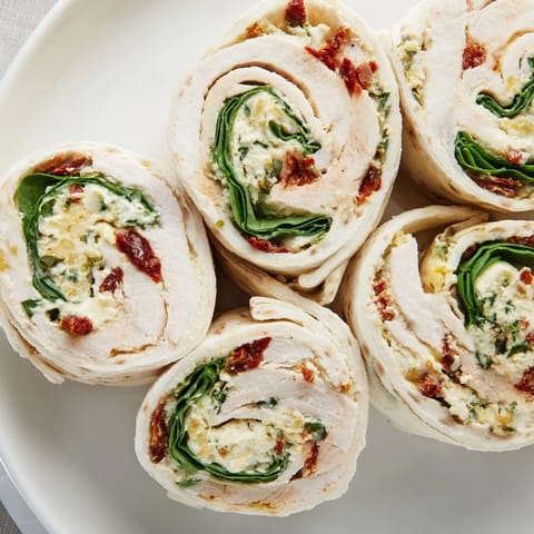 Creamy cheese and sun-dried tomatoes bursting from rolled turkey in these easy roll-ups, an Italian delight.