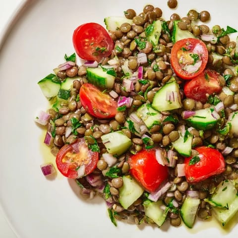 Freshly tossed lentil salad, featuring vibrant veggies, is perfect for a light, healthy lunch.