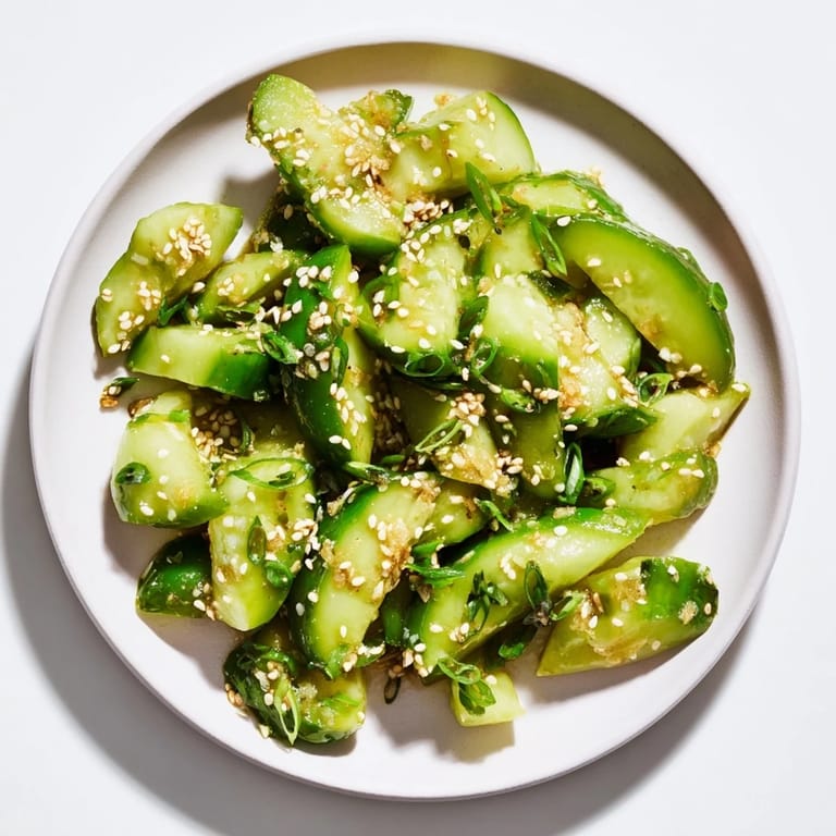 Close-up of the Cucumber Shaker recipe, featuring bright cucumbers and a savory, tangy dressing.