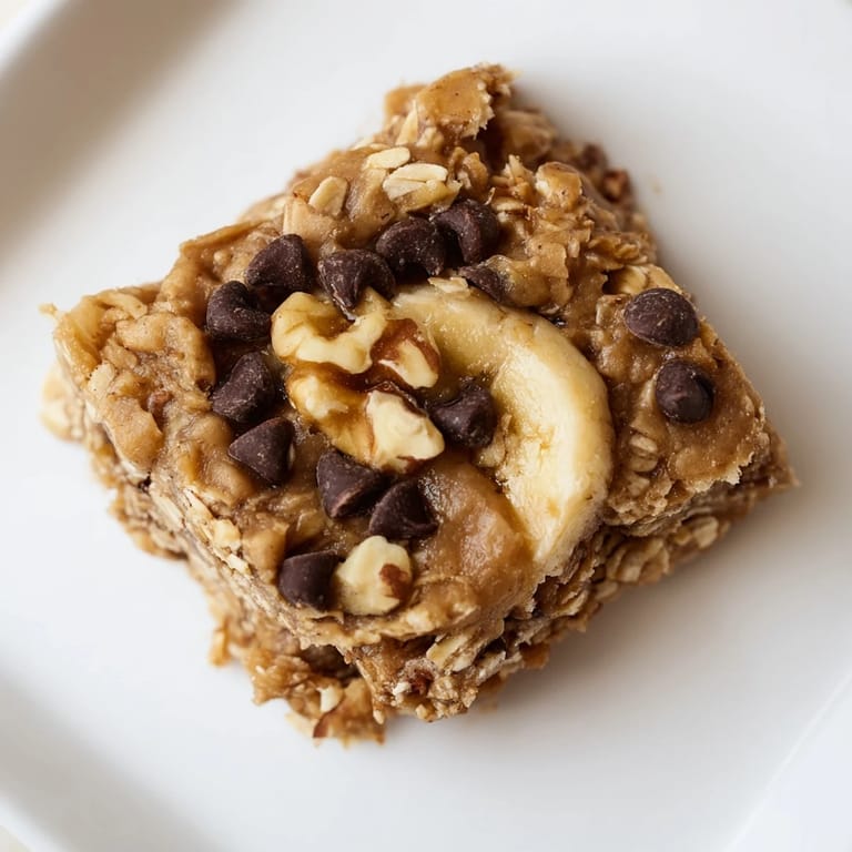 Golden peanut butter banana oat bars, perfectly chilled and ready to enjoy as an energy snack.