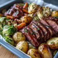 Golden sheet pan corned beef and cabbage dinner with tender potatoes, carrots, and roasted vegetables.