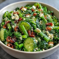 A vibrant Spring Dinner Party Lemon Vinaigrette Salad with crisp radishes and baby greens.  